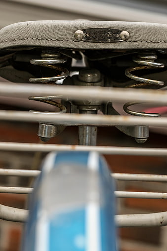 Close-up of vintage bicycle seat springs and metal rack