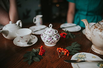Vintage Tea Party Setting with Floral Porcelain and Berries