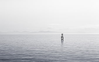 Minimalist Black and White Ocean Landscape with Solitary Tower