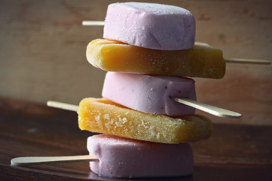 Stack of Frozen Fruit Popsicles on Wooden Sticks
