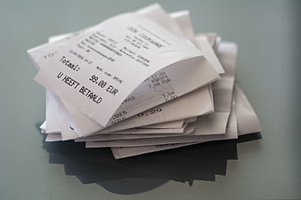 Stack of paper receipts on a table