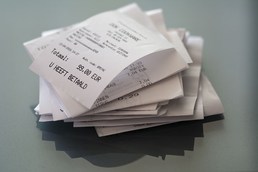 Stack of paper receipts on a table