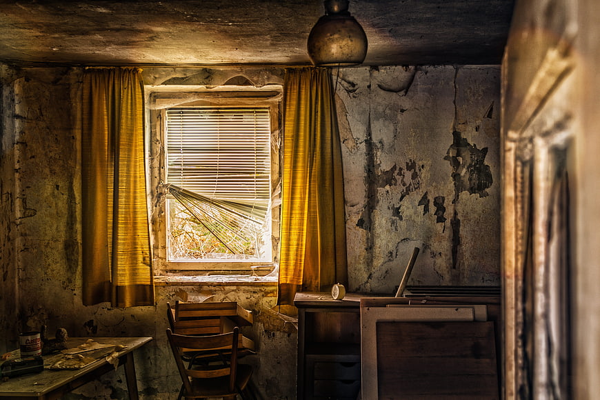 Abandoned Room with Broken Window and Peeling Walls
