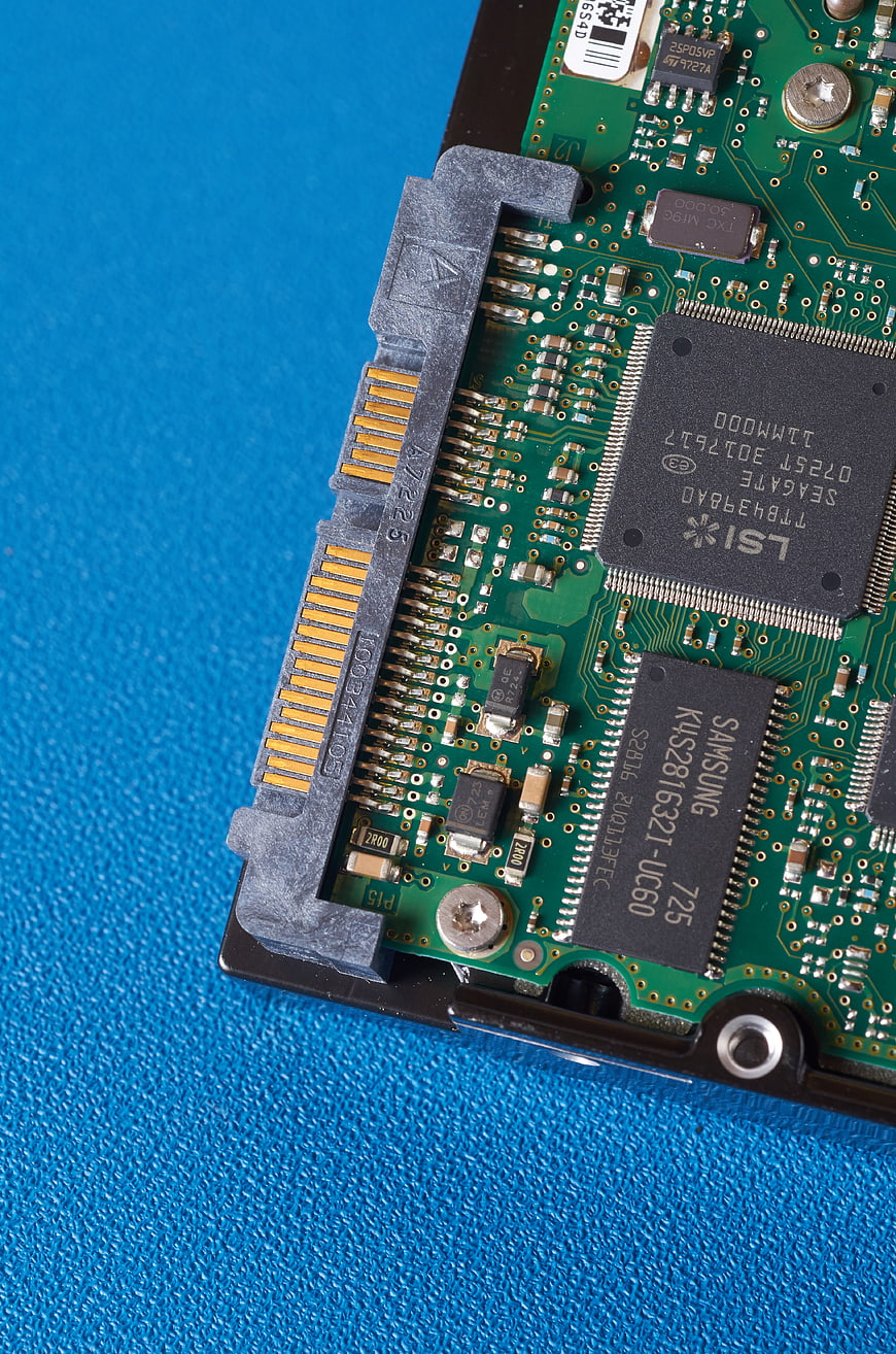 Close-up of Hard Drive Circuit Board on Blue Background