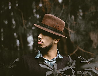 Man in Fedora Hat Looking Away in Forest