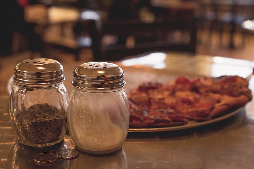 Salt and Pepper Shakers with Pizza in Diner