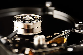 Macro Close-Up of Hard Drive Platter and Actuator Arm