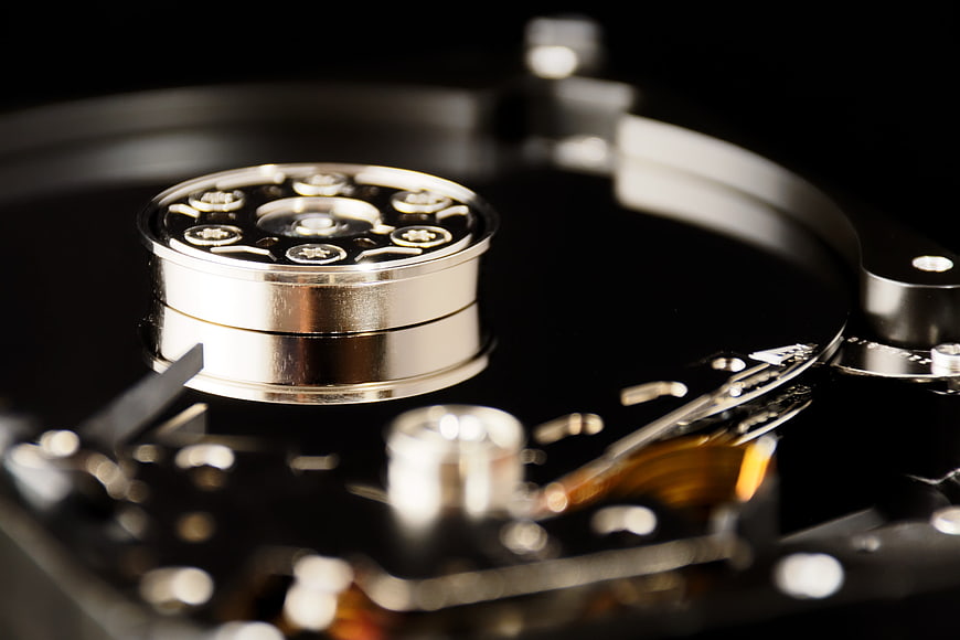 Macro Close-Up of Hard Drive Platter and Actuator Arm