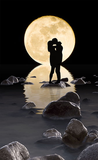 Romantic couple silhouette kissing under giant full moon