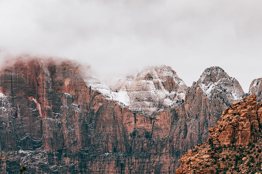 Snowy Red Rock Mountains Shrouded in Mist