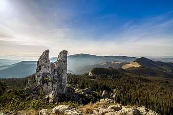 Dramatic Rock Formation in Mountain Forest Landscape
