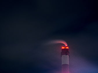 Industrial Chimney with Red Warning Lights Emitting Smoke at Night