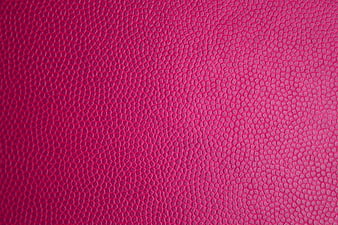 Close-up of vibrant pink textured leather surface