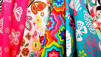 Colorful Patterned Fabric Textiles Hanging in Rows