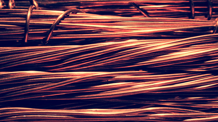 Close-up of copper wire bundles with industrial texture