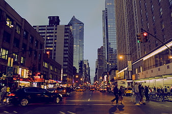 Busy New York City Street at Dusk with Traffic and Pedestrians