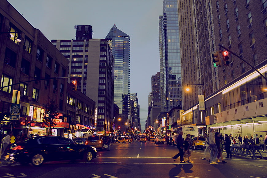 Busy New York City Street at Dusk with Traffic and Pedestrians