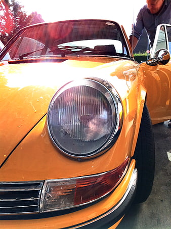 Close-up of vintage orange Porsche 911 headlight