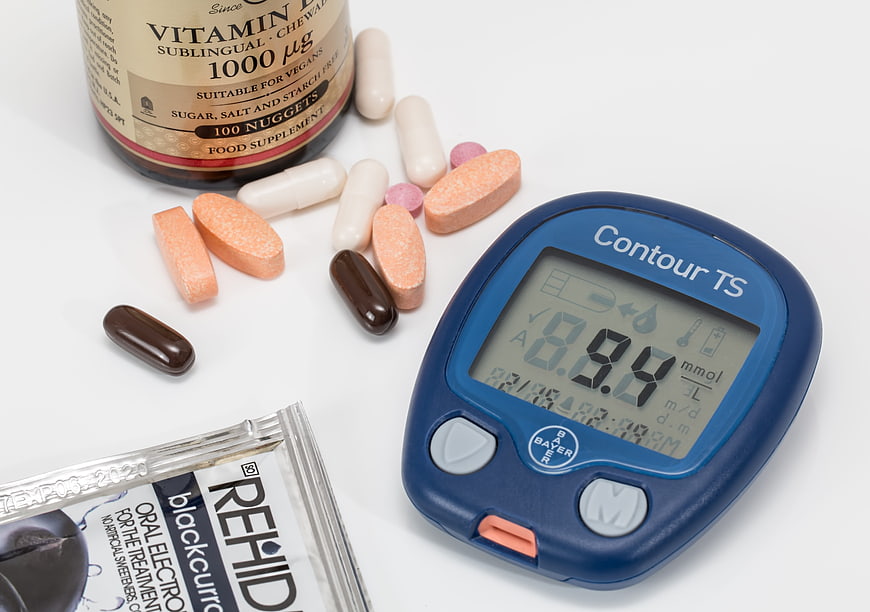 Diabetes management supplies with glucose meter and pills