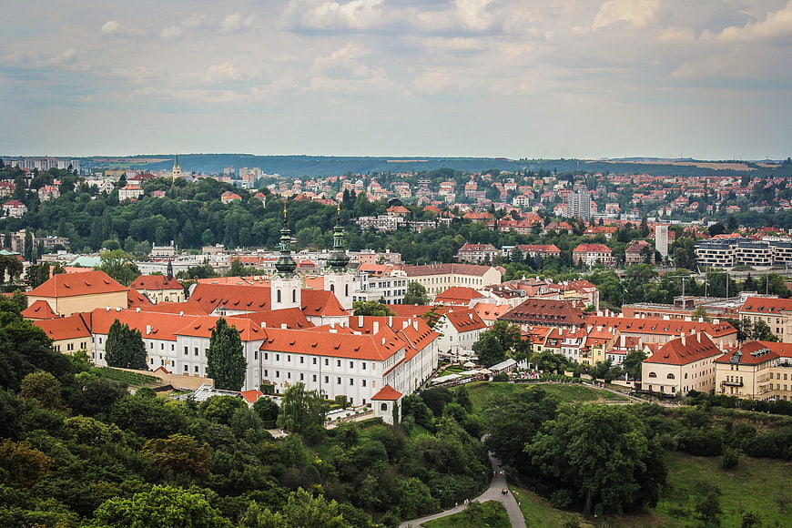 Aerial View of Prague Castle and Red Rooftops in Summer
