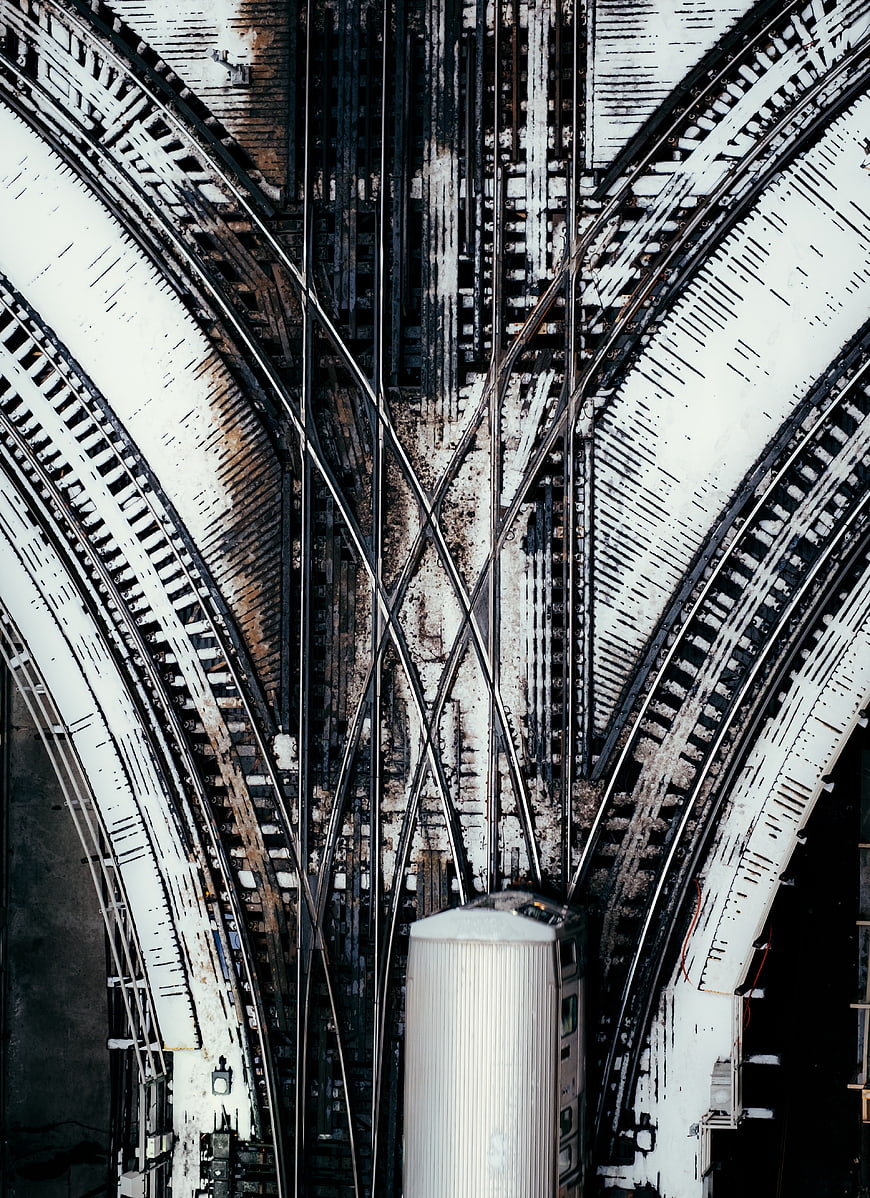 Aerial View of Snow-Covered Railway Tracks and Train