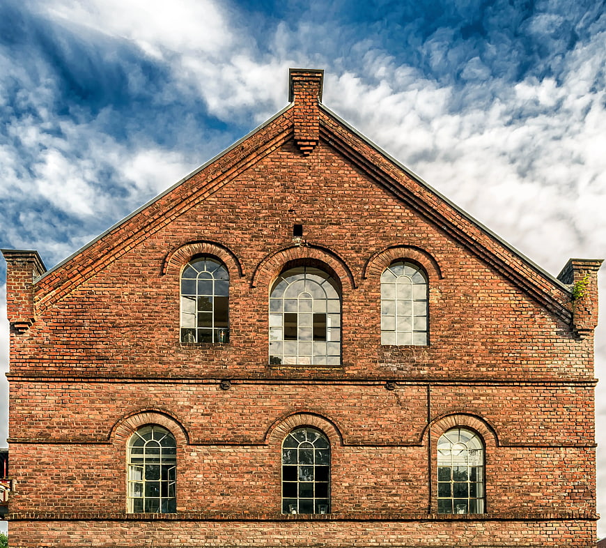 Symmetrical Red Brick Building Facade with Arched Windows
