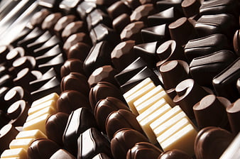 Close-up of assorted dark and white chocolate pieces