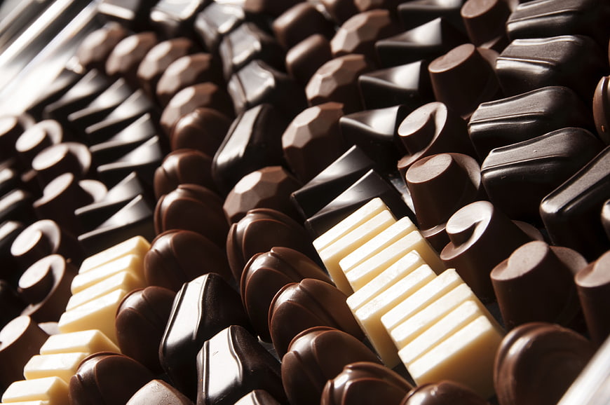 Close-up of assorted dark and white chocolate pieces