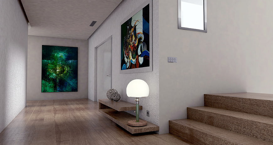 Modern minimalist hallway with abstract art and wooden stairs