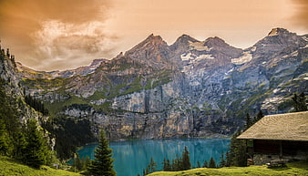 Alpine Lake with Turquoise Water and Mountain Cabin