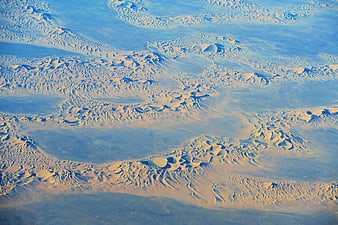 Aerial View of Vast Sand Dunes and Desert Landscape