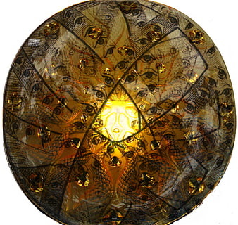 Surreal golden glass plate with repeating eye pattern