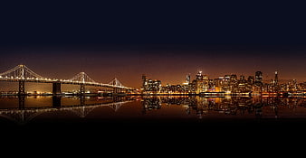 San Francisco Skyline and Bay Bridge at Night with Reflection