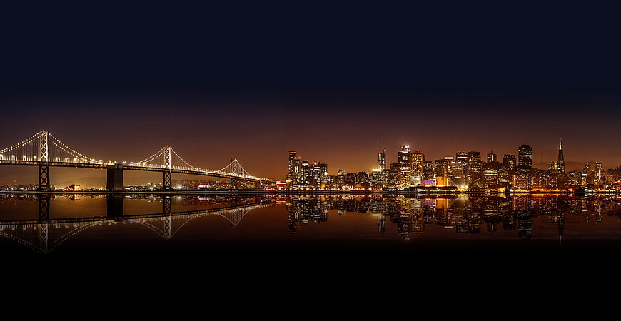 San Francisco Skyline and Bay Bridge at Night with Reflection