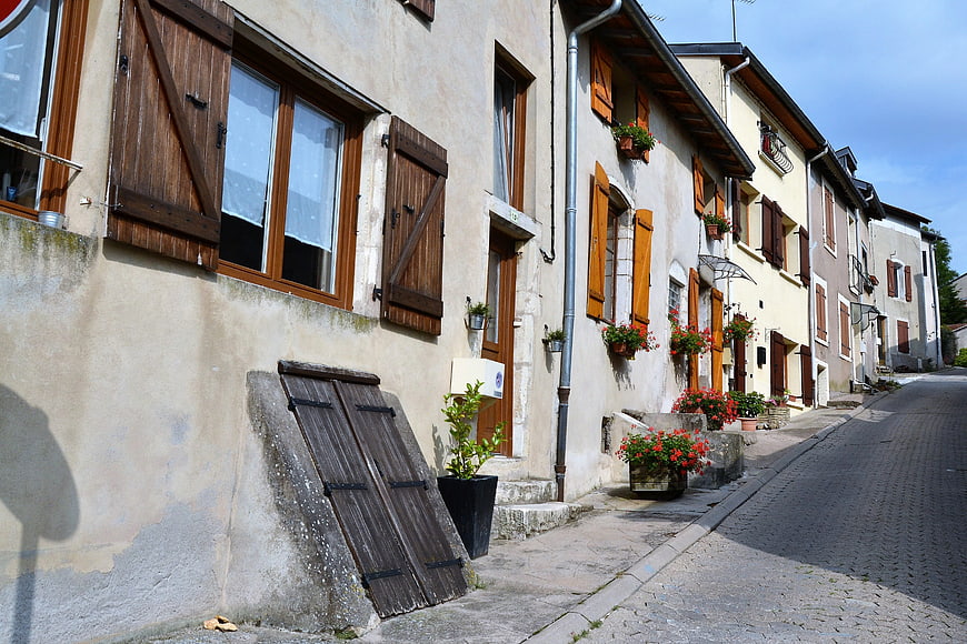 Charming European Street with Wooden Shutters and Flowers