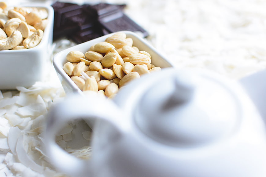 Healthy snacks with almonds, cashews, and dark chocolate