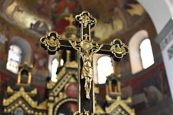 Ornate Gold and Black Orthodox Crucifix in Church Interior