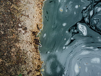 Abstract Top View of Turbulent Water Flowing Over Rough Stone