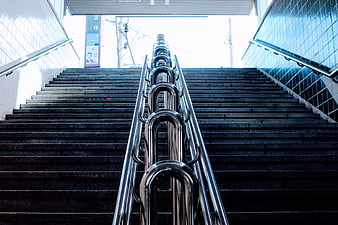 Symmetrical View of Concrete Staircase with Metal Handrails