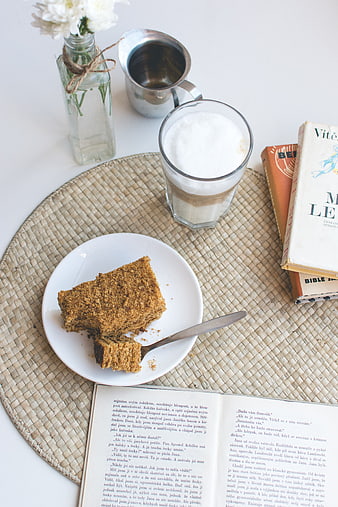Traditional Czech honey cake with latte and books