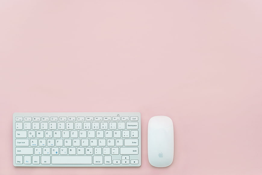 White Keyboard and Mouse on Pink Background Flat Lay