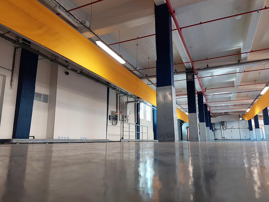 Low angle view of empty industrial warehouse interior