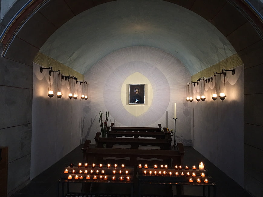 Interior of a small chapel with candles and religious icon
