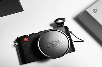 Black Leica Camera Flat Lay on White Background