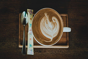Top View Cappuccino with Latte Art on Wooden Tray